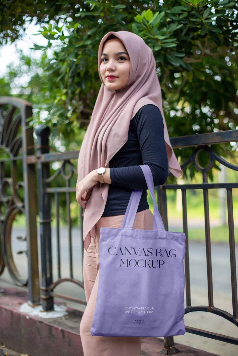 Free Woman in Park Holding Canvas Bag Mockup1