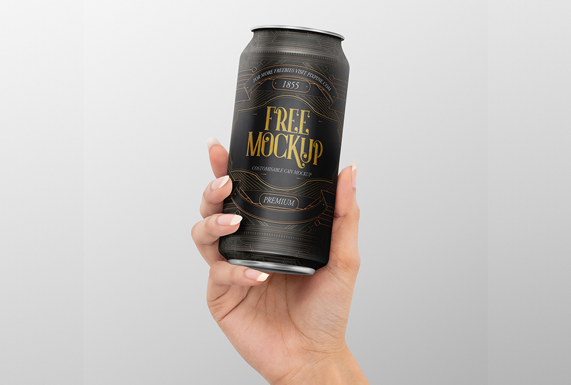 Download Free Hand Holding Realistic Tin Can Mockup Free Package Mockups