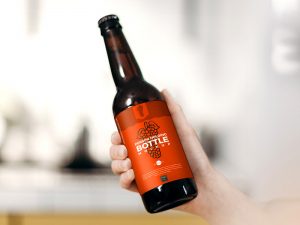 Hand Holding Beer Bottle with Lable Mockup
