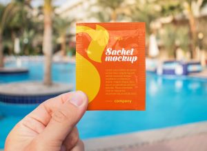 Hand Holding Sachet Pouch Packet Mockup