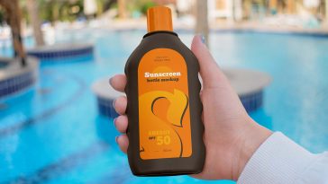 Free Hand Holding Sunscreen Bottle Mockup PSD Set