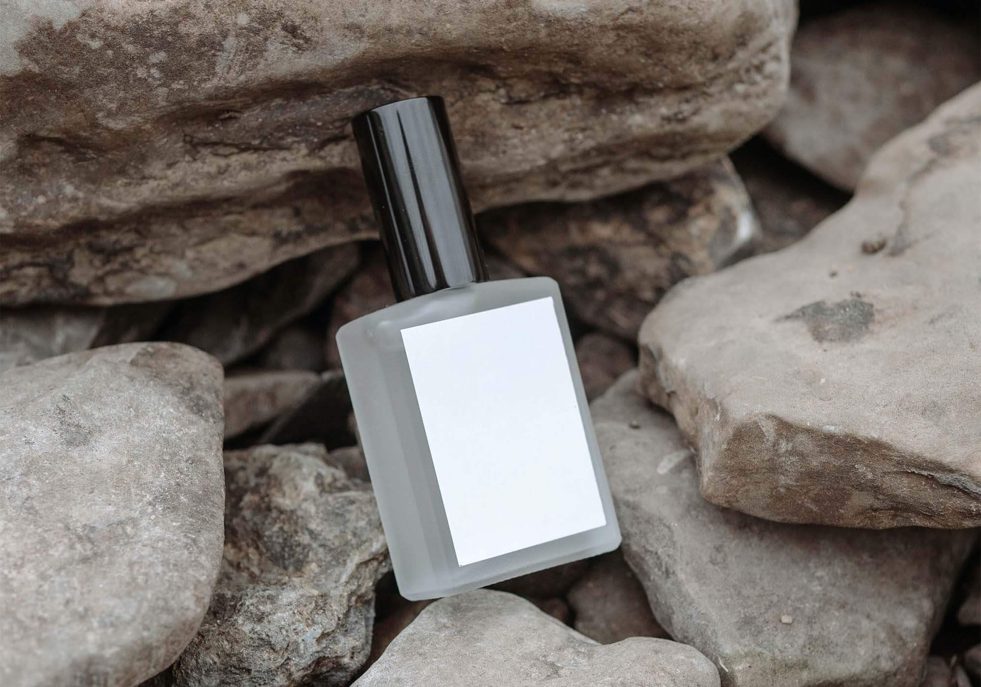 Perfume Bottle on Rocks Mockup 2