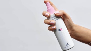 Spray Bottle in Hand Mockup