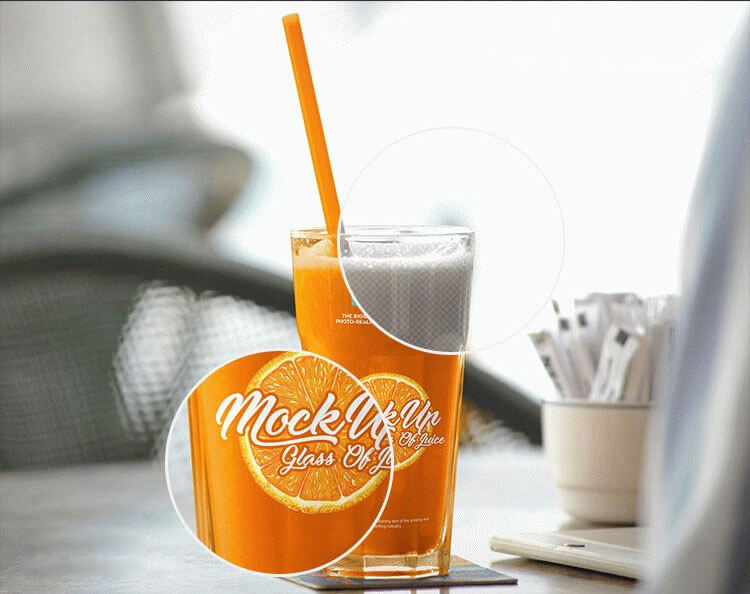Free Mockup Featuring Big Glass of Juice on a Table at a Cafe 2