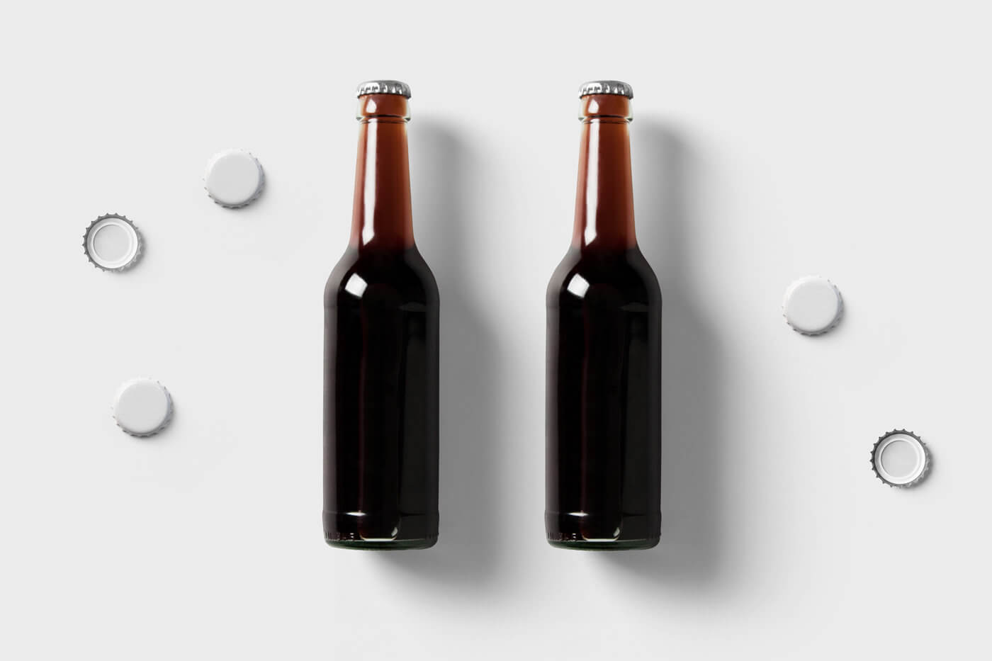 2 glass bottles mockup with caps in front sight 2