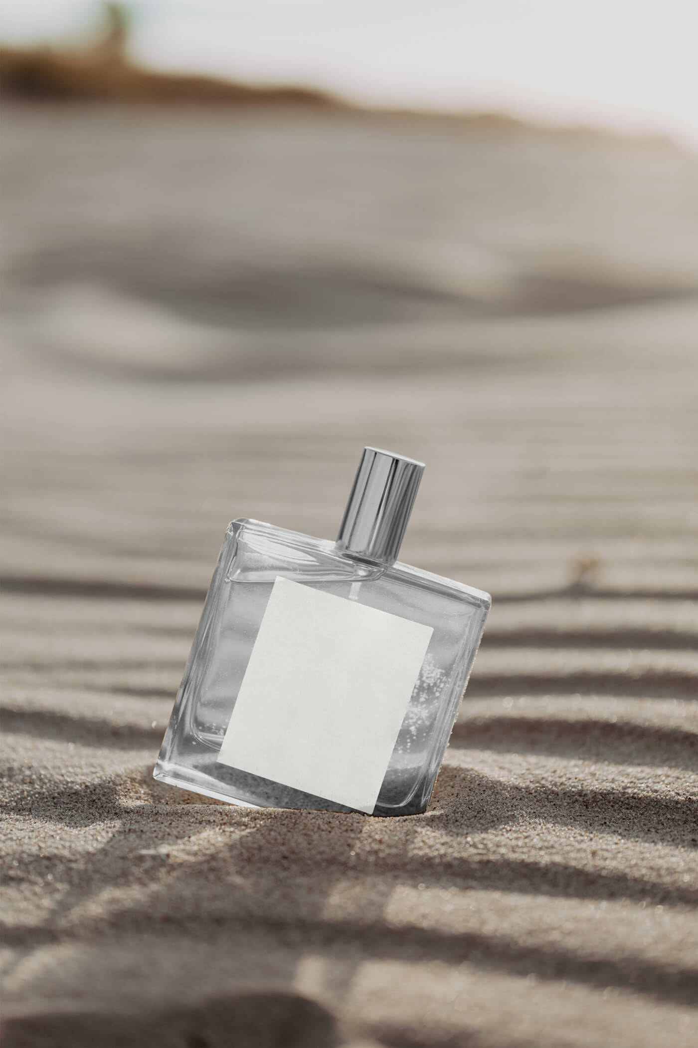 Transparent Bottle on Sunny Beach Mockup