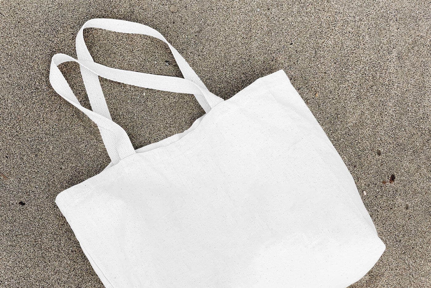 mockup of a lying cotton canvas bag 2