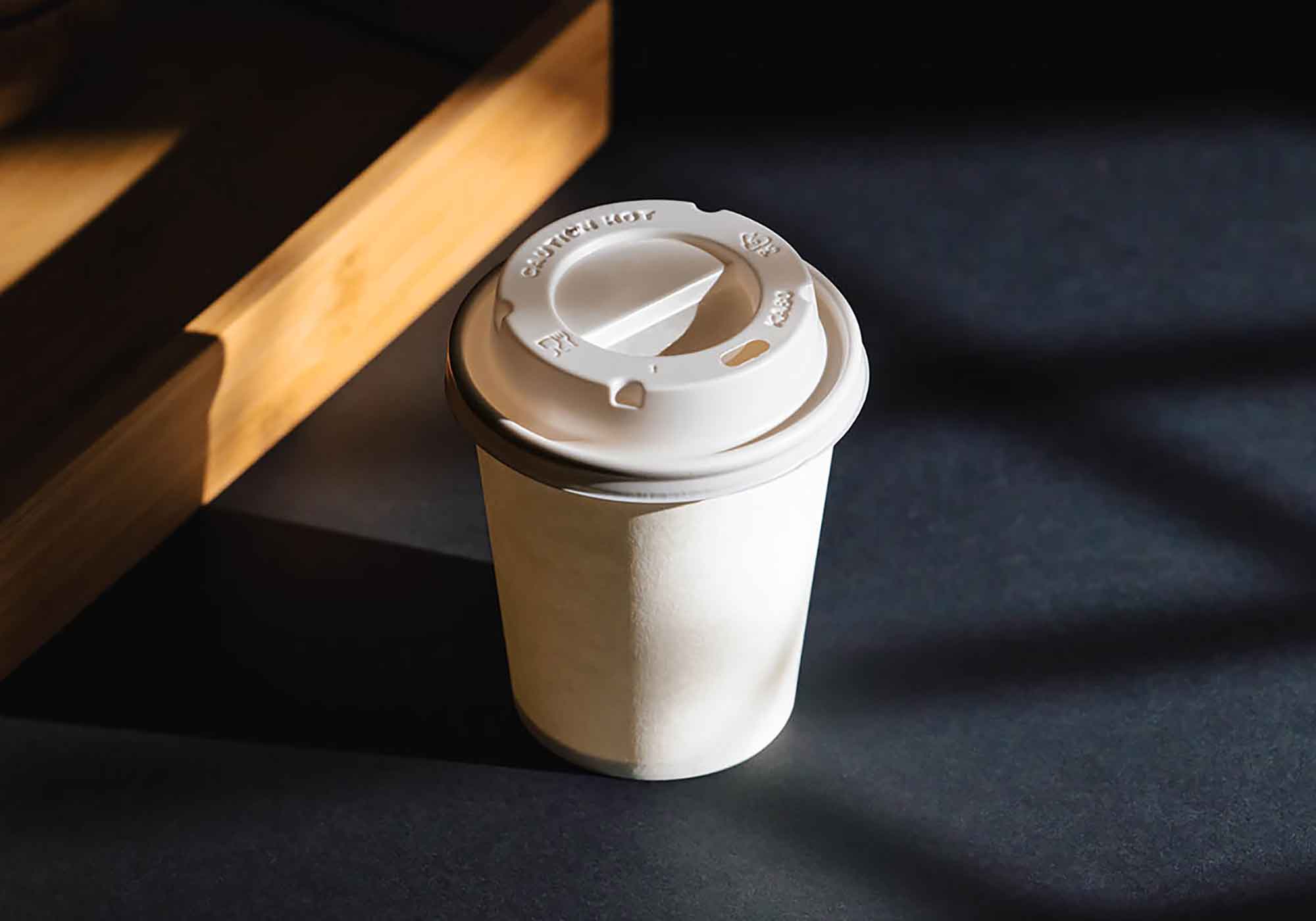 Coffee Cup on Black Background Mockup 2