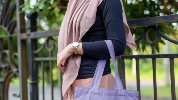 Free Woman in Park Holding Canvas Bag Mockup1