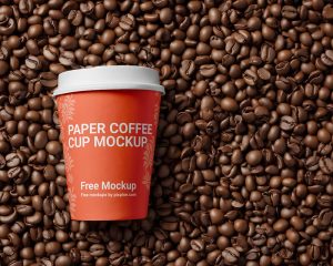 Free Paper Cup on Coffee Beans Mockup 1