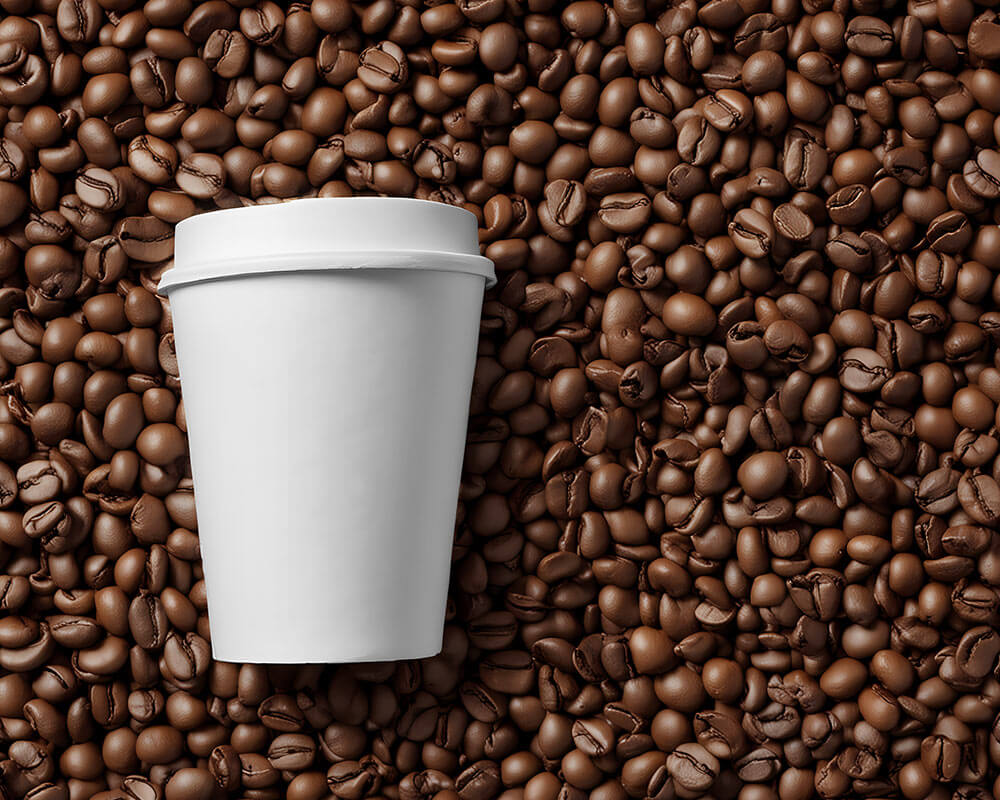 Free Paper Cup on Coffee Beans Mockup 2