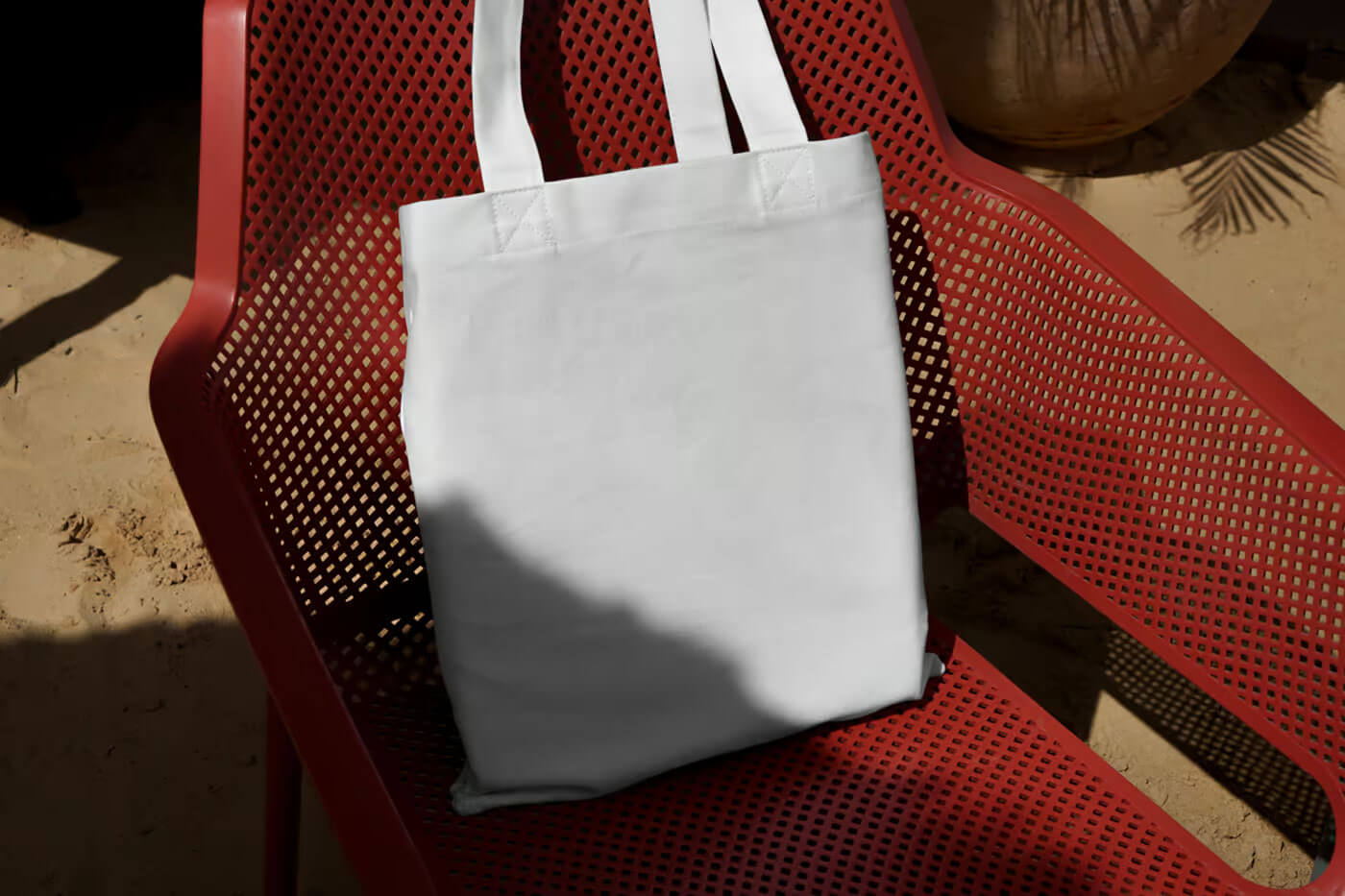 Free Canvas Bag on Plastic Chair Mockup PSD1