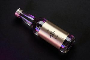 Glass bottle label mockup with metallic wrap sticker and realistic lighting for premium packaging branding