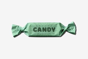 Free candy foil wrapper mockup PSD with twisted packaging design for confectionery branding presentation