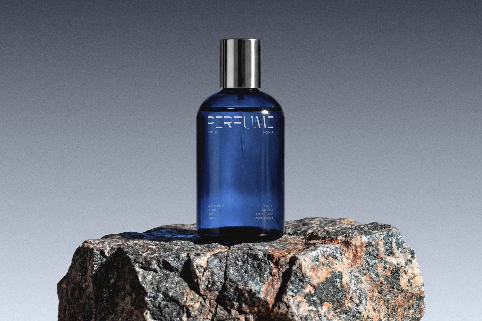 Perfume bottle mockup on stone base with luxury glass packaging and realistic lighting