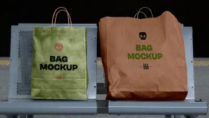 Kraft paper bag mockup PSD on a street chair for retail branding and shopping bag packaging design