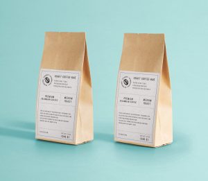Free kraft paper bag mockup PSD featuring two standing coffee bags for food packaging and branding in Photoshop